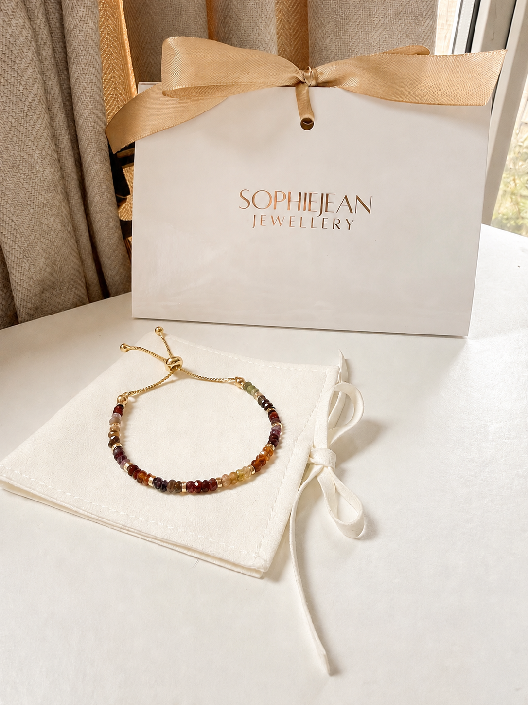 Gold Tundra Sapphire September birthstone bracelet with SophieJean Jewellery gift packaging