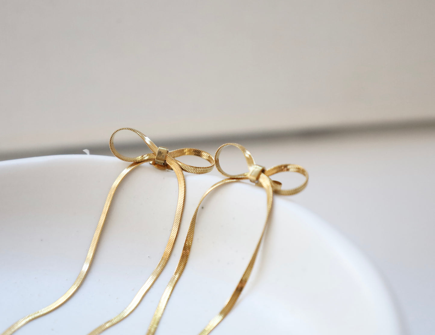 Gold Bow Snake Chain Drop Earrings